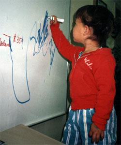 Merit students begin learning how to write in preschool.